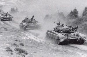 military tanks attacking black and white